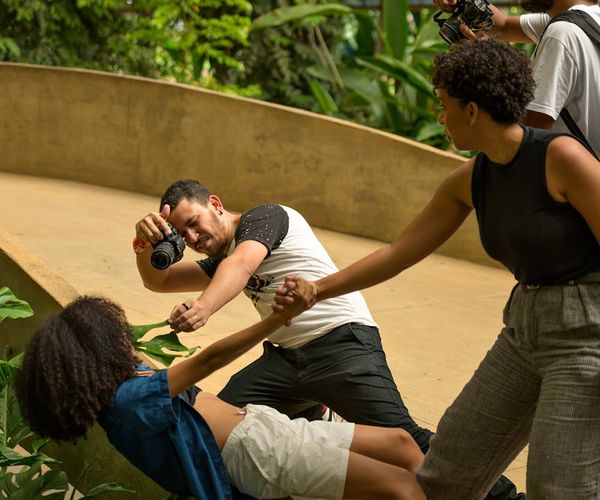 Diverse group of people smiling during a light yoga session.